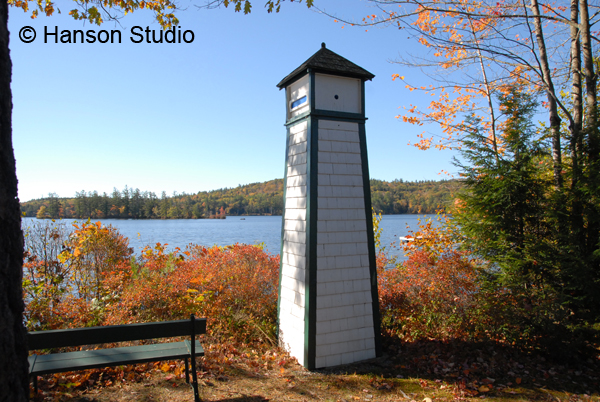 Sutton, NH - Little Lighthouse and Bench on Kezar Lake - Fall